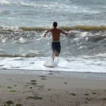 a guy running into the ocean