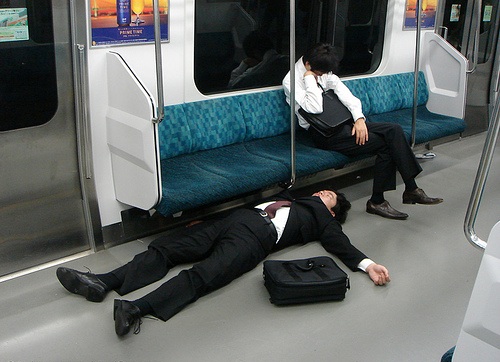 a drunken salary man passed out in the metro