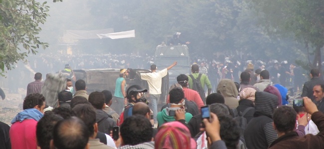 police clash with protesters in tahrir square