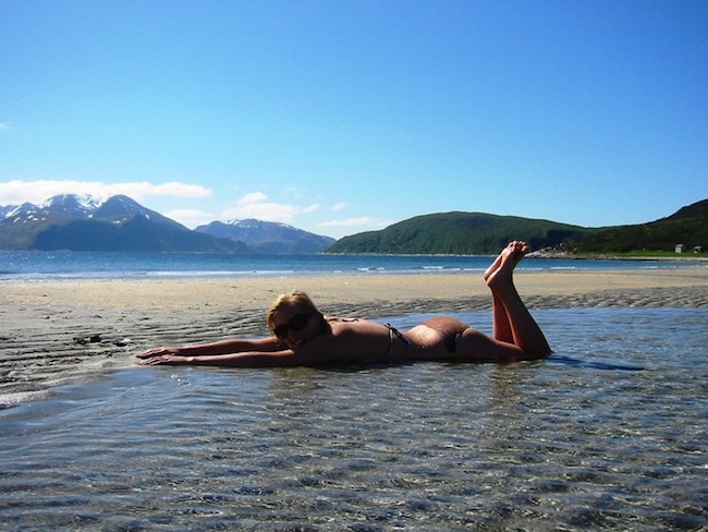 a norwegian girl swimming in northern norway