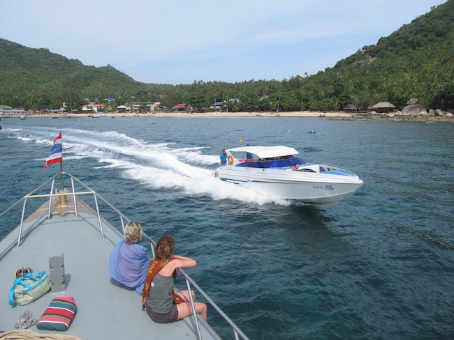 backpacker girls riding a ferry to koh pha ngan thailand
