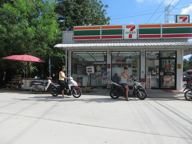 riding scooters to the seven eleven in thailand