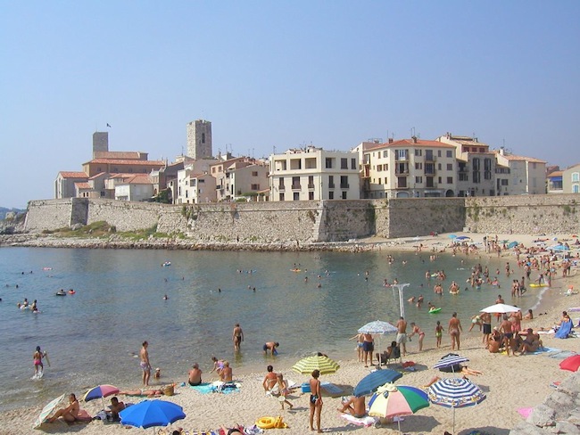 a beach in the port city of antibes france