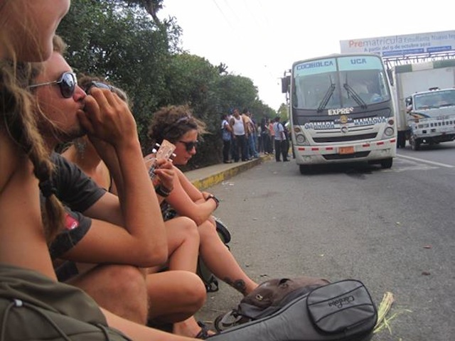 playing harmonica on the street in nicaragua