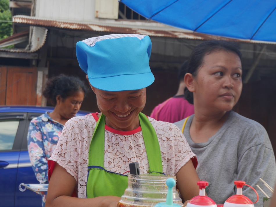 smiling thai street vendor