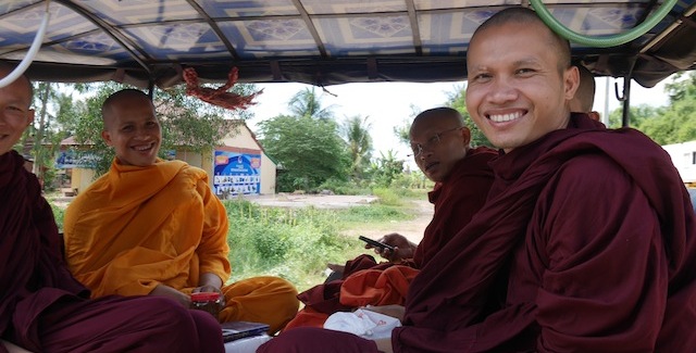 cambodian monks in a tuk tuk