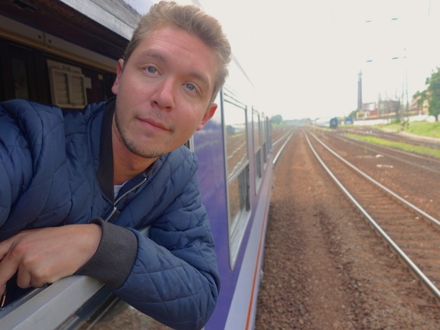 hanging out of a train in budapest